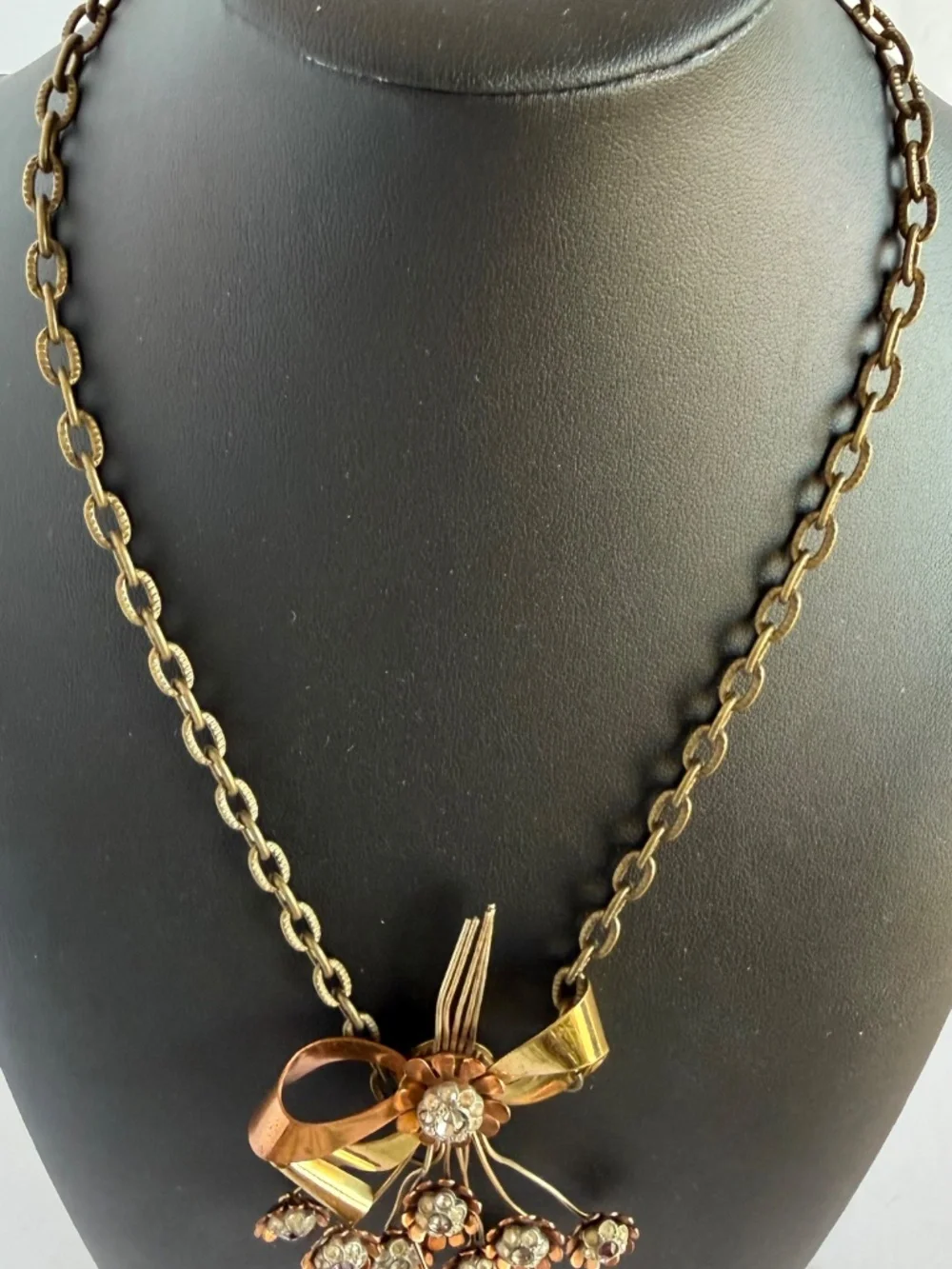 Vintage Necklace Featuring a Ribbon Bow Motif with a Dangling Bouquet of Flowers